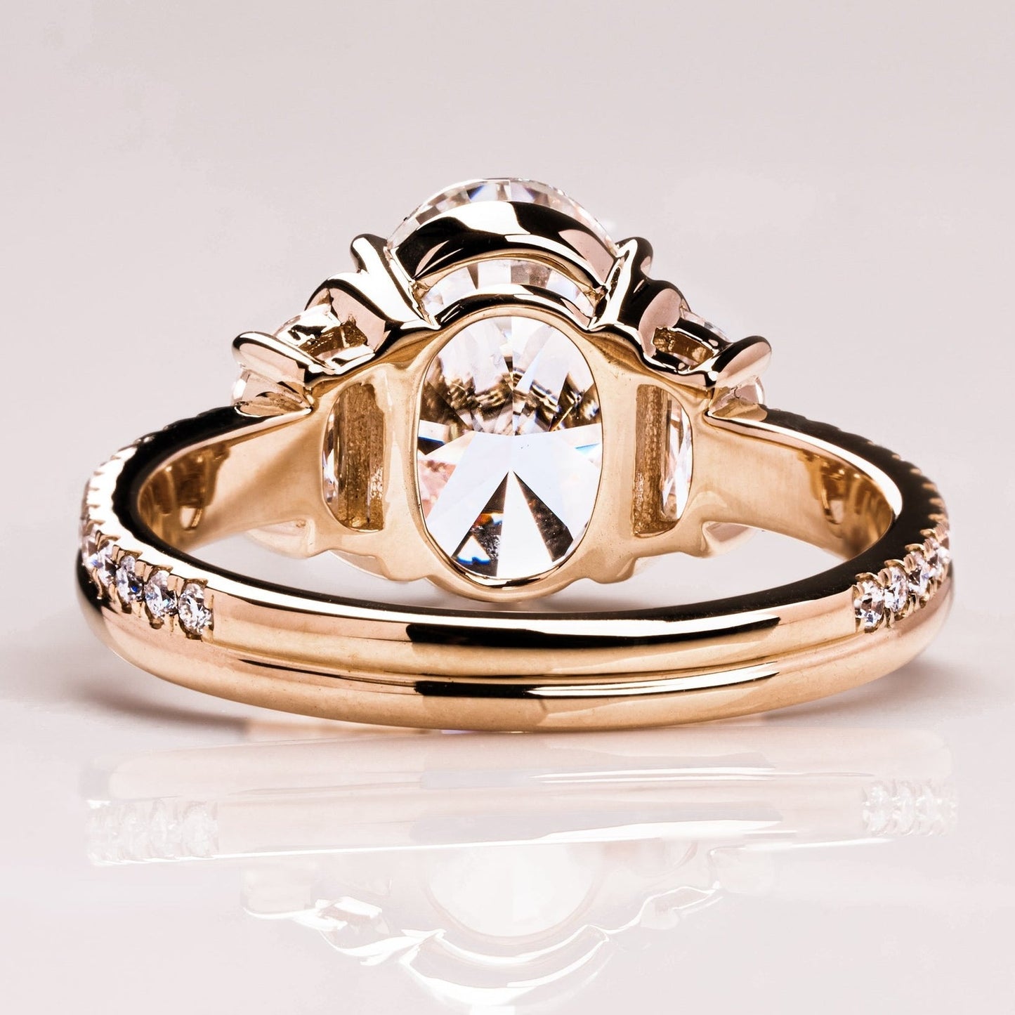 Oval Cut With Half Moon Three Diamond Ring