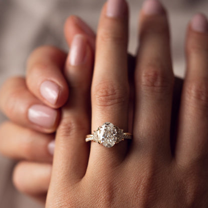 Oval Cut With Half Moon Three Diamond Ring