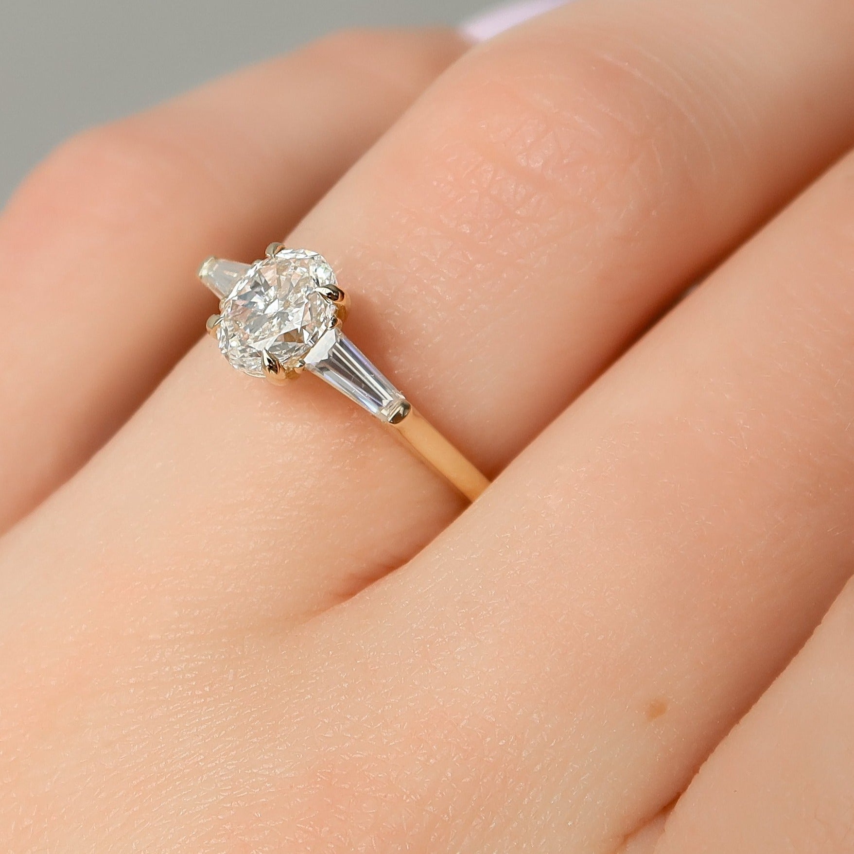  Oval And Tapered Baguette Diamond Ring