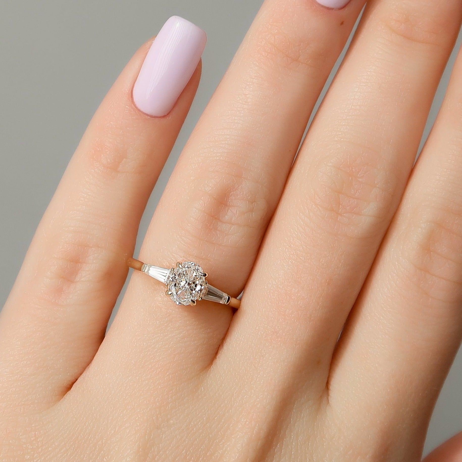  Oval And Tapered Baguette Diamond Ring