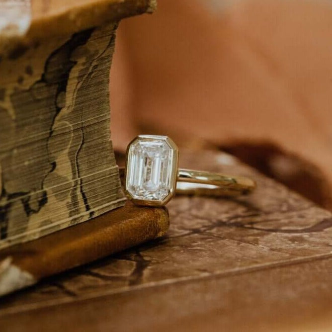  14K Yellow Gold Emerald Cut Bezel Set Wedding Ring