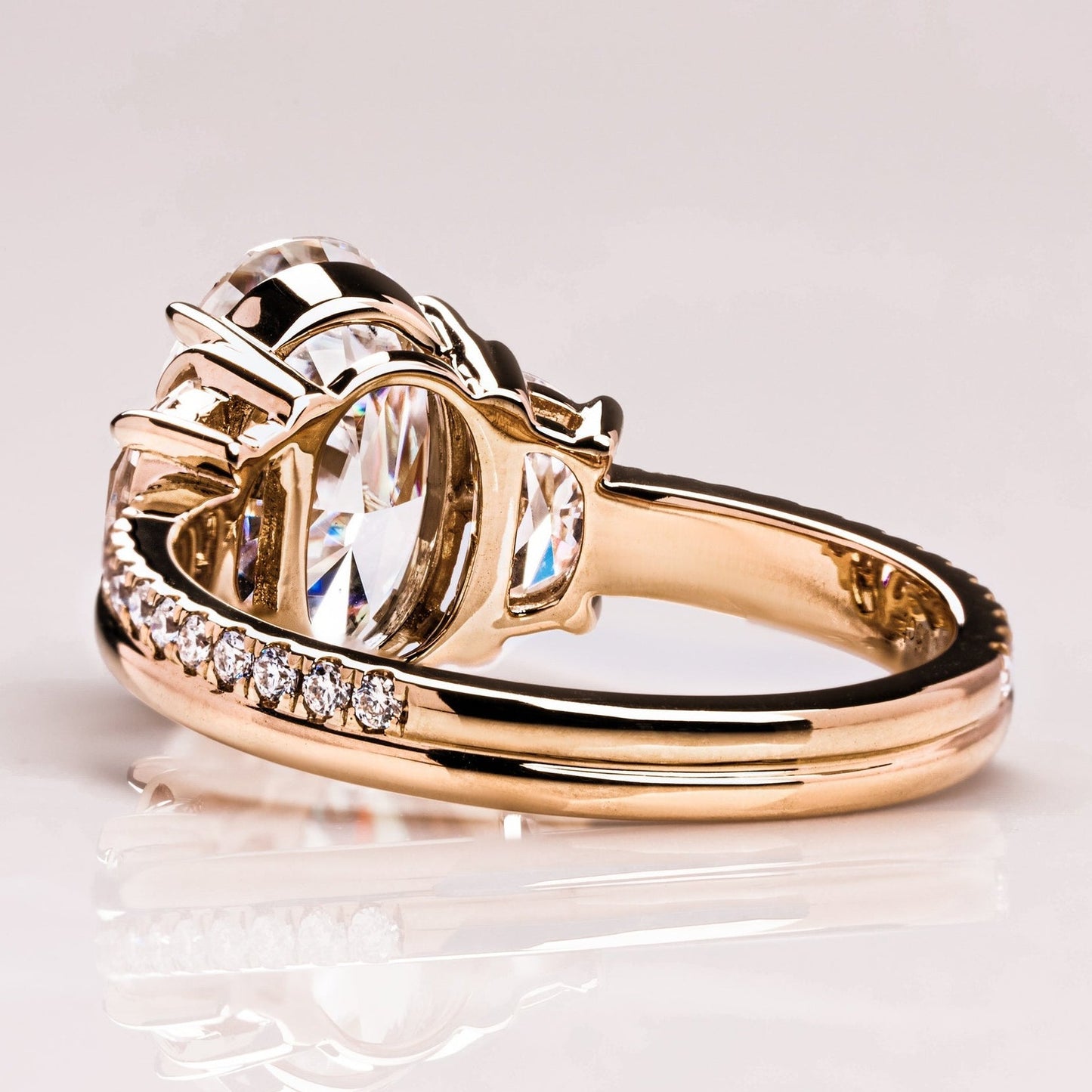 Oval Cut With Half Moon Three Diamond Ring