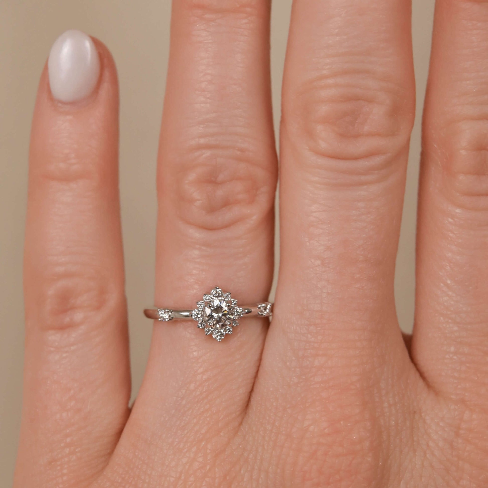 Round Diamond Starburst Halo Ring